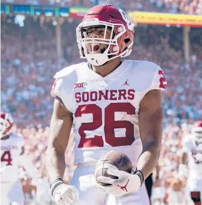  ?? JEFFREY MCWHORTER/AP ?? Oklahoma running back Kennedy Brooks celebrates a fourth-quarter touchdown against Texas on Saturday in Dallas.