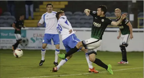  ??  ?? Ryan Brennan fires home Bray’s second goal past Paddy McCourt.