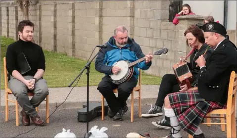  ??  ?? Luke McDonald, Ger Brennan, Mary Hayes and Hamish Stuartwho provided the music at the open air mass outside Cois Barry Community House, Rosslare celebrated by Fr James Murphy PP to commemorat­e all those who lost their lives during lockdown.