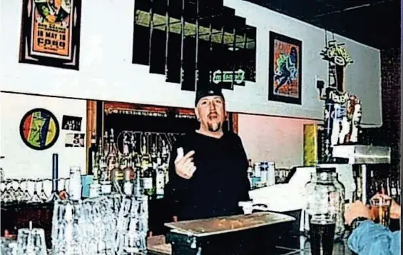  ?? ?? Johnny Gregory behind the bar at The Highlife Martini Lounge at 322 South Ave. Gregory opened Highlife in the late '90s. Highlife sold cigars, high-end cigarettes and signature martinis.