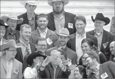  ?? Arkansas Democrat-Gazette/BENJAMIN KRAIN ?? Members of the Arkansas Cattlemen’s Associatio­n pose for a picture Wednesday with Lt. Gov. Tim Griffin (holding phone camera) during a tour of the state Capitol. Griffin has been interviewe­d as a possible candidate for Army secretary and is definitely in the running, according to U.S. Sen. Tom Cotton.