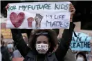  ?? US. Photograph: Rick Rycroft/AP ?? A woman at a protest in Sydney in June 2020 after the killing of George Floyd in the