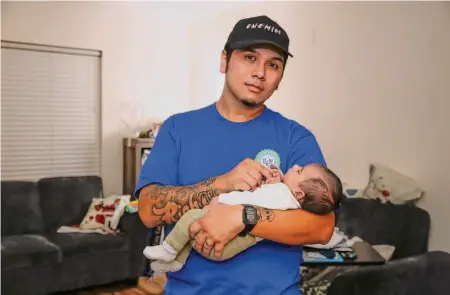  ?? Salgu Wissmath/The Chronicle ?? Striker Robin López, shown with infant son Ometeotl López, is hoping the action wins more child support for campus workers.