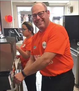  ??  ?? Swift Current Mayor Denis Perrault helped behind the service counter during the Burgers to Beat MS event hosted at the Swift Current A&W Restaurant on August 22. The chain wide fundraiser was held last Thursday in support of Canadians living with Multiple Sclerosis. $2 from every Teen Burger sold that day was donated to the MS Society of Canada.