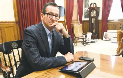  ?? Dan Haar / Hearst Connecticu­t Media ?? Gov. Dannel P. Malloy in his office in Hartford on Dec. 21.