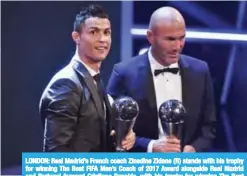  ??  ?? LONDON: Real Madrid’s French coach Zinedine Zidane (R) stands with his trophy for winning The Best FIFA Men’s Coach of 2017 Award alongside Real Madrid and Portugal forward Cristiano Ronaldo, with his trophy for winning The Best FIFA Men’s Player of...