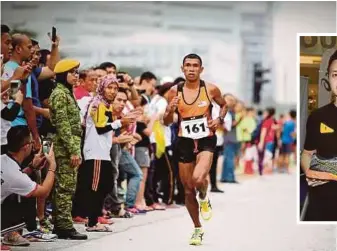  ??  ?? Muhaizar running the Sea Games marathon recently, in which he bagged a bronze medal.