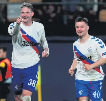  ??  ?? Net gains: Kyle Lafferty sets off in celebratio­n after drawing Rangers level in Spain