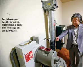 ?? EPA ?? Der Unternehme­r Kenji Oribe zeigt in seinem Haus in Suma die Filteranla­ge aus der Schweiz.