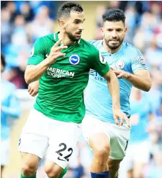  ??  ?? Brighton’s defender Martin Montoya (left) vies with Manchester City’s striker Sergio Aguero during the English Premier League match at the Etihad Stadium in Manchester, north west England in this Sept 29 file photo. — AFP photo