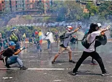  ?? FOTO: AP ?? In der venezolani­schen Hauptstadt Caracas kam es im Sommer immer wieder zu gewaltsame­n Protesten gegen Staatspräs­ident Nicolás Maduro.