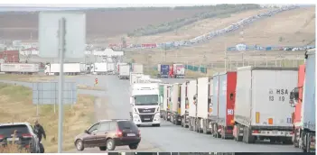  ?? — AFP photos ?? Cars are seen queueing on the Russian side of the border with Kazakhstan near the Kazakh Syrym crossing point.