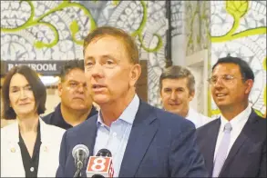  ?? Emilie Munson / Hearst Connecticu­t Media ?? Gov. Ned Lamont spoke to reporters at Tribus Beer Company in Milford late last month. Lamont, who seems to clearly enjoy his job, often has strayed off the planned messaging when it comes to important issues.