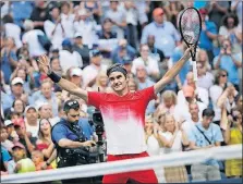  ?? [AP PHOTO/ANDRES KUDACKI] ?? Roger Federer, of Switzerlan­d, reacts after defeating Mikhail Youzhny, of Russia, during the second round of the U.S. Open Thursday in New York.