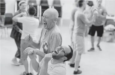  ??  ?? Larry Cappel, back, and Kelly Costello dance with the Rocky Mountain Rainbeaus at the Washington Street Community Center in Denver on July 17.