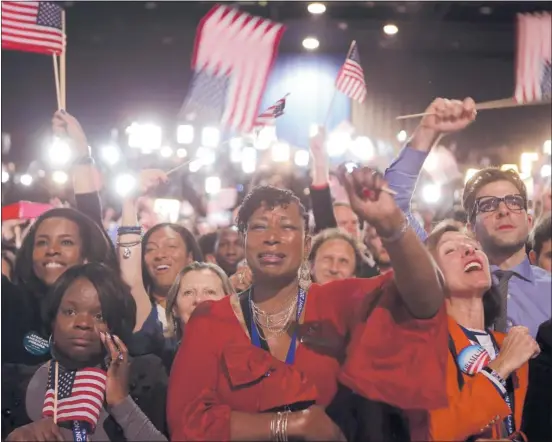  ?? CHIP SOMODEVILL­A/ GETTY IMAGES ?? Supporters in Chicago celebrate President Barack Obama’s victory Tuesday night after following poll numbers and Electoral College votes throughout the evening.