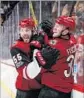  ?? Christian Petersen Getty Images ?? ARIZONA’S Jason Demers and Christian Fischer celebrate a goal.