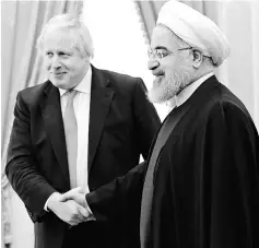  ??  ?? A handout picture shows Rouhani meeting Johnson in the Iranian capital Tehran. — AFP photo