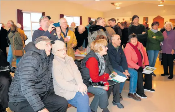  ?? Photos / Christine McKay ?? Dannevirke residents were keen to watch the NZTA’s digitally produced flyover video footage of the proposed new route to replace the closed State Highway 3 through the Manawatu Gorge.