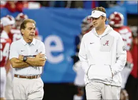  ?? MIKE ZARRILLI / GETTY IMAGES ?? After failed stints elsewhere, Lane Kiffin (right) was widely considered virtually unhireable before Alabama head coach Nick Saban named him offensive coordinato­r after the 2013 season.