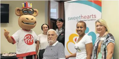  ?? Picture: MADELEINE CHAPUT ?? WHEELCHAIR DRIVE: Rodney Hodgkinson (front, centre) sits in his new wheelchair recently donated to him by PnA. Pictured with Hodgkinson are, from left, PnA mascot Penny, Gussie Eberhardt, PnA manager Elmarie Krause, Frere Hospital occupation­al...