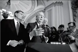  ?? ASSOCIATED PRESS ?? SENATE MAJORITY LEADER MITCH MCCONNELL, R-KY., joined by (from left) Sen. John Barrasso, R-Wyo., Sen. Roy Blunt, R-Mo., and Majority Whip John Cornyn, R-Texas, speaks with reporters at the Capitol in Washington on Tuesday.