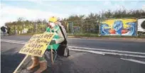  ?? Associated Press ?? A fracking protester sits outside the energy firm Cuadrilla’s site in Preston New Road, Little Plumpton, Lancashire, England, on Monday.