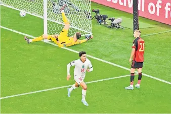  ?? — AFP photo ?? Zakaria Aboukhlal (centre) celebrates scoring his team’s second goal during the Qatar World Cup Group F football match between Belgium and Morocco at the Al-Thumama Stadium in Doha.