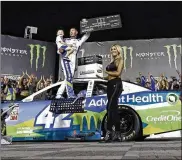  ?? CHUCK BURTON / ASSOCIATED PRESS ?? Kyle Larson celebrates in Victory Lane after winning the NASCAR All-Star Race at Charlotte Motor Speedway in Concord, N.C., on Saturday.