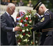  ?? AP PHOTO/ANDREW HARNIK ?? President Joe Biden lays a wreath at The Tomb of the Unknown Soldier at Arlington National Cemetery on Monday in Arlington, Va.