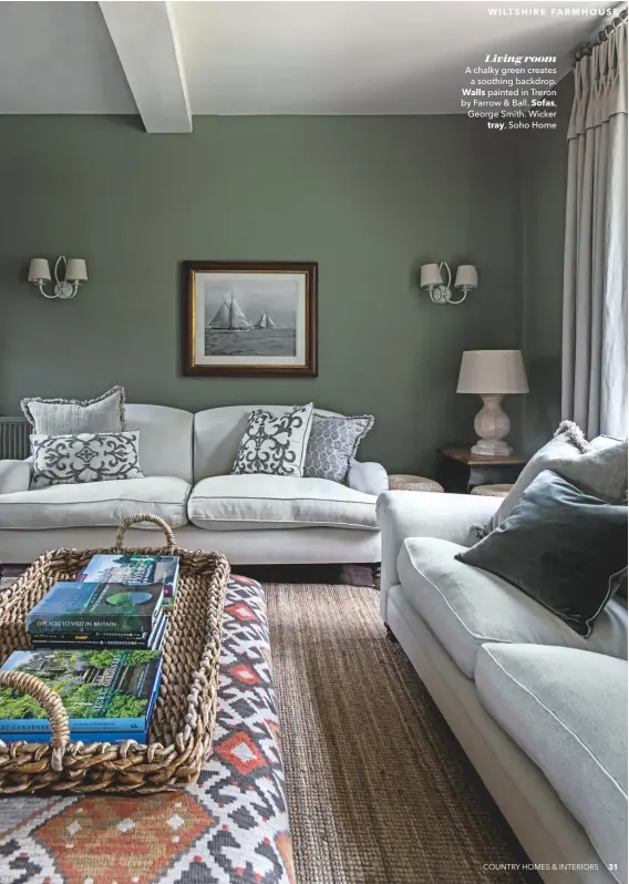  ??  ?? Living room
A chalky green creates a soothing backdrop. Walls painted in Treron by Farrow & Ball. Sofas, George Smith. Wicker tray, Soho Home