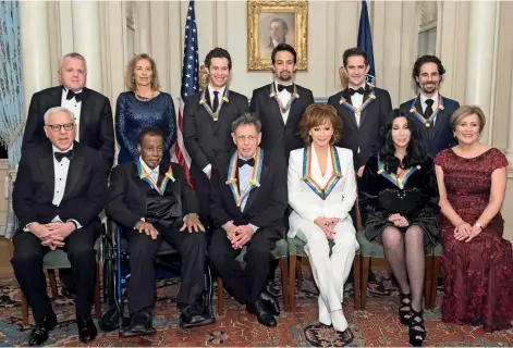  ??  ?? Kennedy Center honorees Wayne Shorter, Philip Glass, Reba Mcentire, Cher, Kennedy Center President Deborah Rutter; back row from left, Deputy Secretary of State John Sullivan, Grace Rodriguez, and honorees, Thomas Kail, Lin-manuel Miranda, Andy Blankenbue­hler and Alex Lacamoire