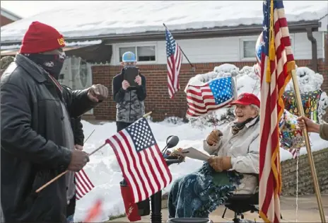  ?? Emily Matthews/Post-Gazette ?? George Scott, left, of Mt. Lebanon, and Bernie Hoffman sing Frank Sinatra’s “My Way” after a parade to celebrate Mr. Hoffman’s 95th birthday Saturday outside his home in Scott.