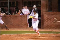  ?? Staff photo by Kelsi Brinkmeyer ?? ■ Texas High’s Valerie Perez hits the ball during their game against Longview Friday night.