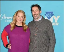  ?? ANGELA WEISS — AFP/GETTY IMAGES/TNS ?? Amy Schumer and her husband chef Chris Fischer arrive for the season five New York premiere of “Inside Amy Schumer”, at the Pendry Hotel in New York City on Oct. 18, 2022.