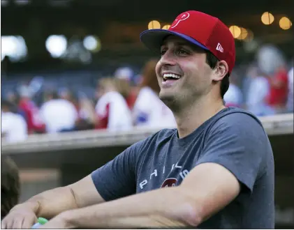  ?? DERRICK TUSKAN — THE ASSOCIATED PRESS ?? Phillies relief pitcher Mark Appel smiles in the dugout before the team’s game against the Padres on Saturday in San Diego.
