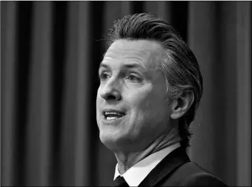  ?? AP Photo/Rich Pedroncell­i ?? In this Jan. 8 file photo, California Gov. Gavin Newsom speaks during a news conference in Sacramento, Calif. Gov. Newsom could likely face a recall election this year.