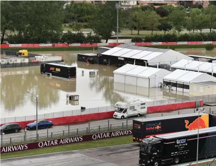  ?? Photo: Jennifer Lorenzini/Reuters ?? The paddock at Imola is left under water after the nearby Santerno river burst its banks.