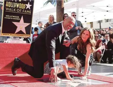  ?? EPA PIC ?? Actor Dwayne Johnson, his partner Lauren Hashian and their daughter Jasmine at the ceremony to honour him with a star on the Hollywood Walk of Fame in Hollywood on Wednesday.