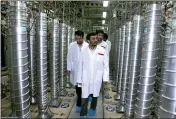  ?? IRANIAN PRESIDENT'S OFFICE VIA AP, FILE ?? Then-Iranian President Mahmoud Ahmadineja­d, center, visits the Natanz Uranium Enrichment Facility near Natanz, Iran, April 8, 2008.