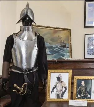  ?? Pics: Donal Hackett. ?? A replica of an Armada soldier’s armour, surrounded by original artwork by Husto Jimeno de Zaga.