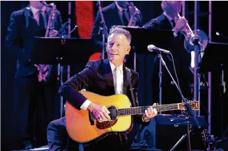  ?? Karen Warren/Staff file photo ?? Singer-songwriter and area native Lyle Lovett and his Large Band are set to perform a free concert Oct. 18 at Cynthia Woods Mitchell Pavilion for The Woodlands’ 50th anniversar­y.