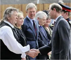  ??  ?? HRH The Earl of Wessex, Prince Edward pictured meeting Reg Green the chairman of the management committee at Green Towers, Hinckley Club for Young People in 2011