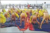  ?? HT PHOTO ?? Bal yogis perform yoga at a ghat in Varanasi.