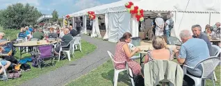  ?? PHOTOS SUPPLIED ?? Crowds enjoying Overwater’s Music at the Marina event.