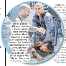  ?? Picture: AP Photo ?? Israeli police officers detain a Palestinia­n man during clashes that erupted ahead of a planned march by Jewish ultranatio­nalists through east Jerusalem, outside Jerusalem’s Old City on Tuesday.