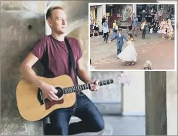  ??  ?? ROMANTIC Busker Will Tierney made a couple’s day