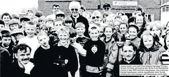  ??  ?? Young visitors and staff from Edward Heneage Primary School, Grimsby, pictured at the Tertia Trust Residentia­l Centre in May 1993 with Mrs Hargreaves, vice-chairman Harold Hargreaves, centre, receptioni­st John Turrell, knelling left, and manager Jeff Hargreaves, front right.