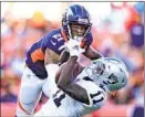  ?? Jack Dempsey Associated Press ?? RAIDERS receiver Henry Ruggs III (11) pulls in one of his three catches in front of the Broncos’ Ronald Darby.