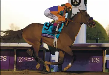  ?? MICHAEL CONROY — THE ASSOCIATED PRESS ?? John Velazquez rides Authentic to victory in the Breeders’ Cup Classic on Saturday at Keeneland Race Course in Lexington, Ky.